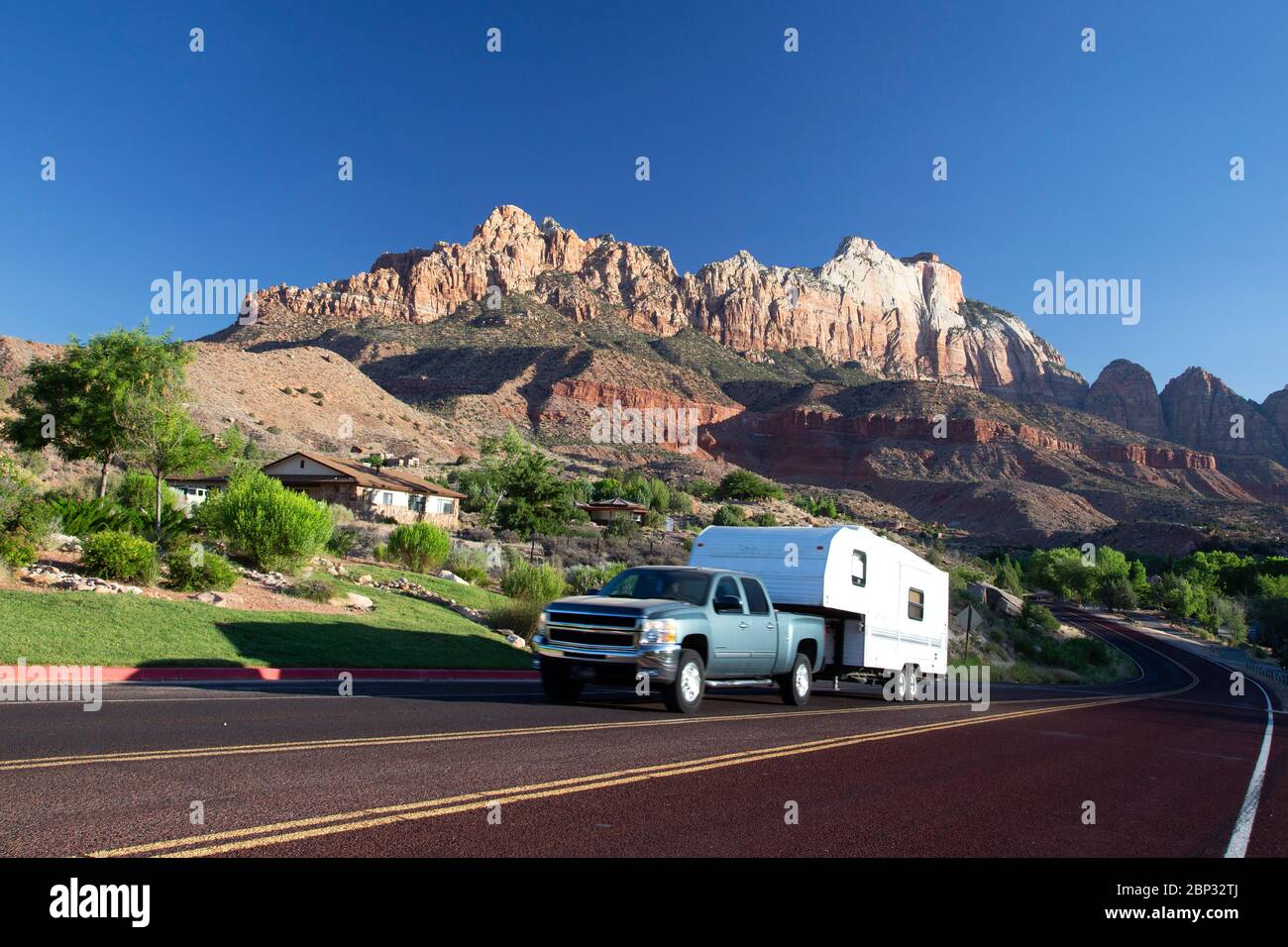 Pickup truck pulling a 5th wheel RV in Springdale, Utah near Zion National Park Stock Photo
