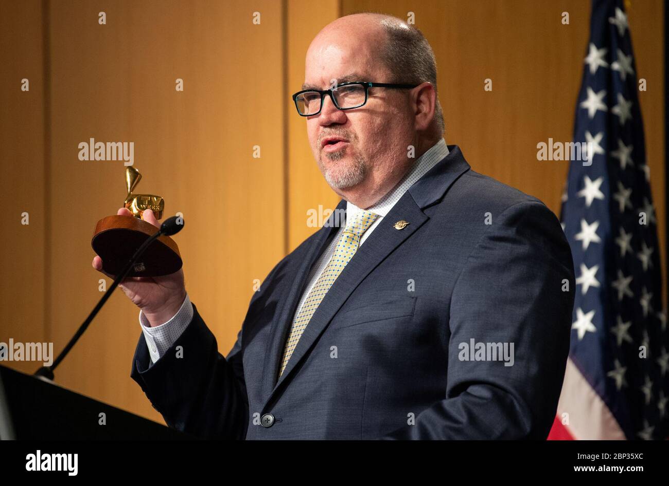 Letter of Intent Signing Between NASA and the Australian Space Agency  NASA Deputy Associate Administrator for Communications Bob Jacobs holds up the Logie Award presented to the crew of Apollo 11 in 1969 as he gives opening remarks prior to the signing of a letter of intent between NASA and the Australian Space Agency, Saturday, Sept. 21, 2019 at NASA Headquarters in Washington. NASA and the Australian Space Agency will build on over 60 years of collaboration in space exploration between the two countries and commit to expanding cooperation. Stock Photo