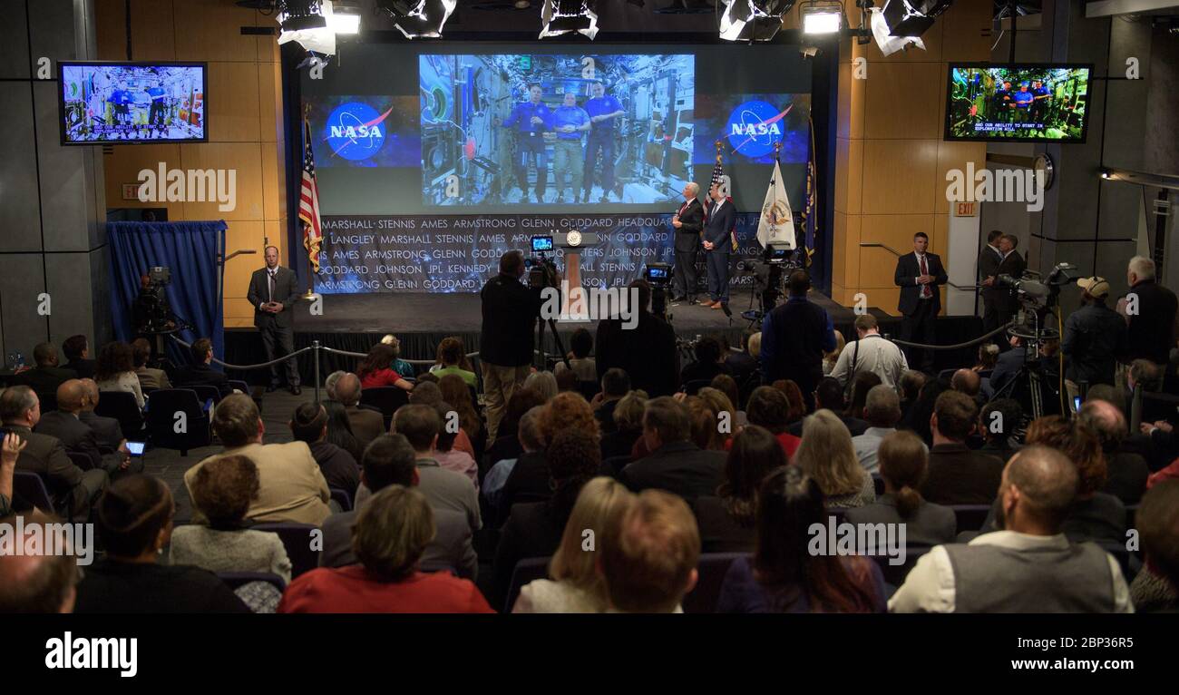 Bridenstine Sworn In As NASA Administrator  Vice President Mike Pence, and NASA Administrator Jim Bridenstine talk with NASA astronauts Scott Tingle, Andrew Feustel, and Ricky Arnold who are onboard the International Space Station, Monday, April 23, 2018 at NASA Headquarters in Washington. Bridenstine was just sworn in by the Vice President as NASA's 13th Administrator. Stock Photo