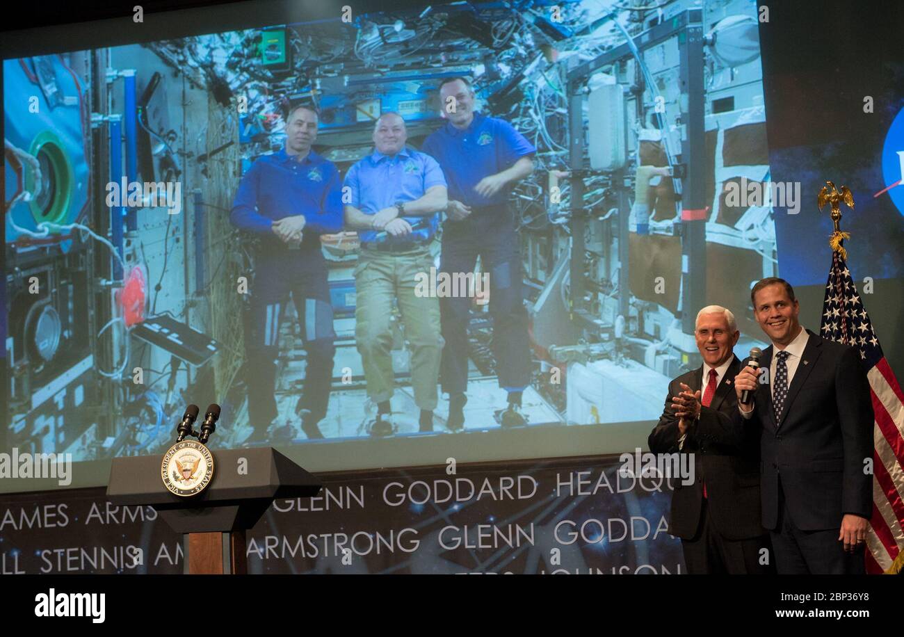 Bridenstine Sworn In As NASA Administrator  Vice President Mike Pence and NASA Administrator Jim Bridenstine talk with NASA astronauts Andrew Feustel, Scott Tingle, and Ricky Arnold who are onboard the International Space Station, Monday, April 23, 2018 at NASA Headquarters in Washington. Bridenstine was just sworn in by the Vice President as NASA's 13th Administrator. Stock Photo