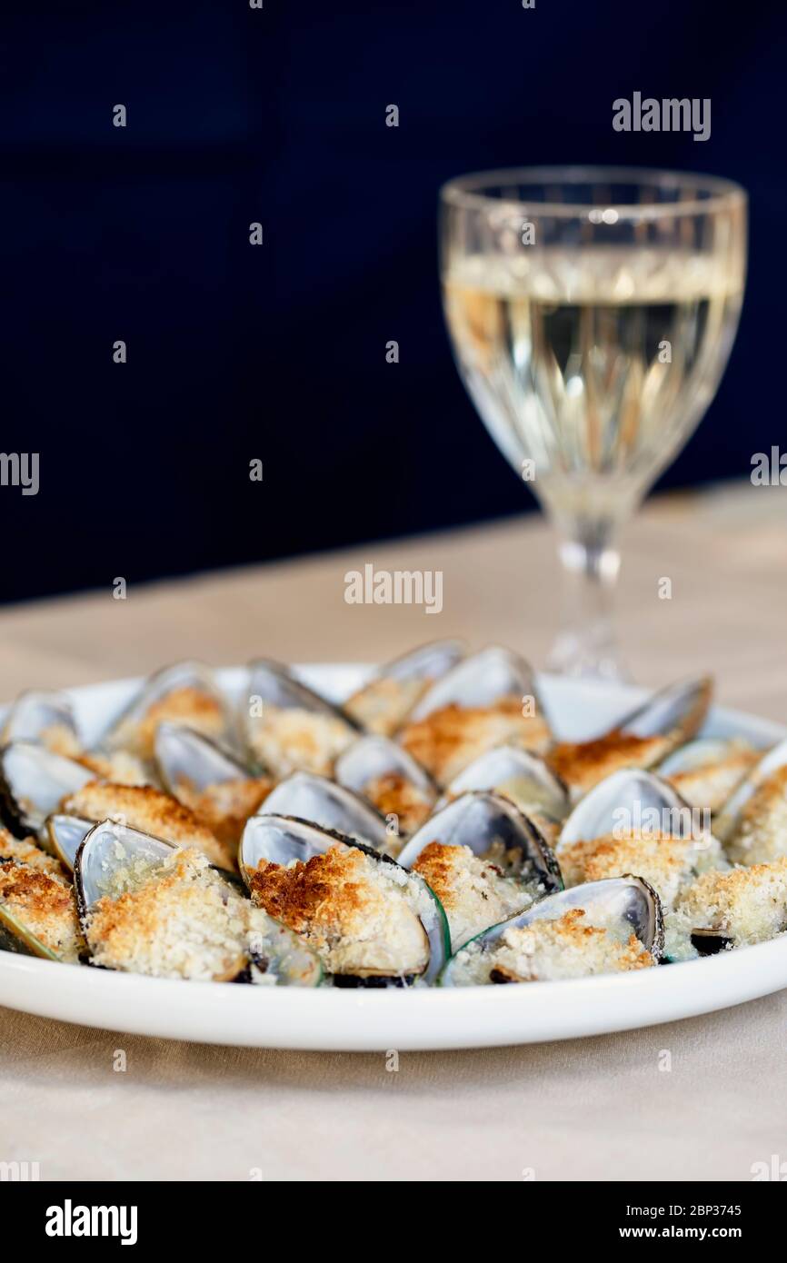 Mussels Baked With Parmesan Bread Crumb And Herb Butter Served On A Plate Glass Of White Wine Food Background Mediterranean Cuisine Concept For A Stock Photo Alamy Mussels Baked With Parmesan Bread Crumb And Herb Butter Served On A Plate Glass Of White Wine Food Background Mediterranean Cuisine Concept For A Stock Photo Alamy