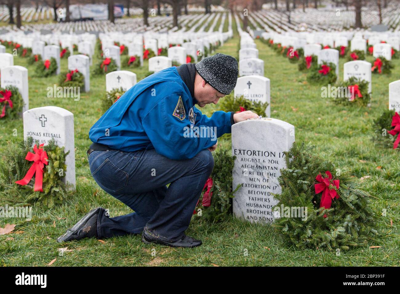 NASA astronaut Doug Wheelock participates in National Wreaths Across America Day on December 14, 2019, by laying a wreath at Arlington National Cemetery to honor military veterans, including those from Extortion 17. Stock Photo