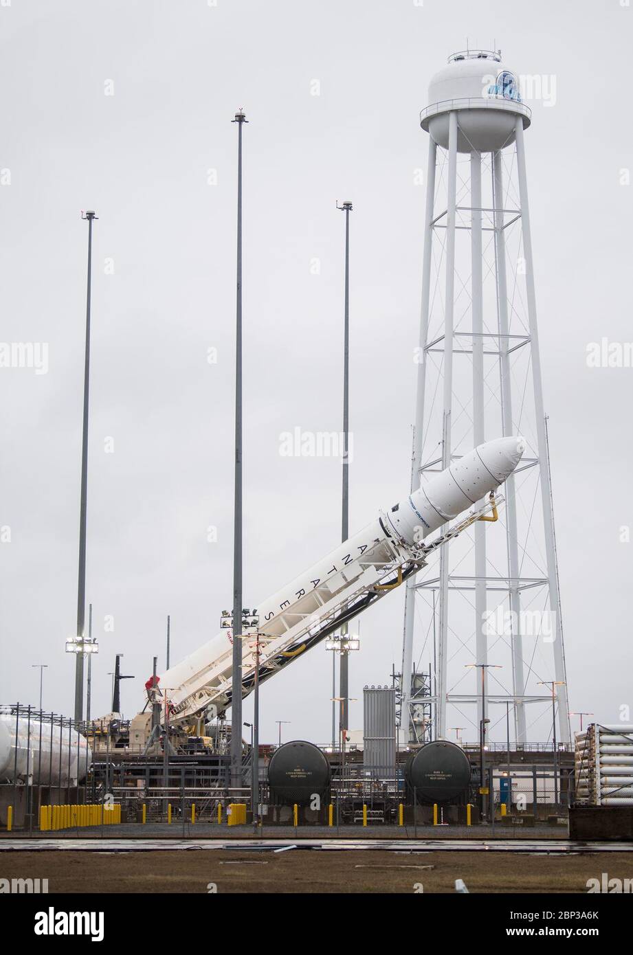 Northrop Grumman Antares CRS-13 Prelaunch  A Northrop Grumman Antares rocket carrying a Cygnus resupply spacecraft is raised into a vertical position on Pad-0A, Wednesday, Feb. 5, 2020, at NASA's Wallops Flight Facility in Virginia. Northrop Grumman’s 13th contracted cargo resupply mission with NASA to the International Space Station will deliver about 8,000 pounds of science and research, crew supplies and vehicle hardware to the orbital laboratory and its crew. The CRS-13 Cygnus spacecraft is named after the first African American astronaut, Major Robert Henry Lawrence Jr., and is scheduled Stock Photo