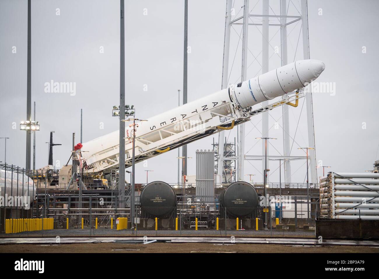 Northrop Grumman Antares CRS-13 Prelaunch  A Northrop Grumman Antares rocket carrying a Cygnus resupply spacecraft is raised into a vertical position on Pad-0A, Wednesday, Feb. 5, 2020, at NASA's Wallops Flight Facility in Virginia. Northrop Grumman’s 13th contracted cargo resupply mission with NASA to the International Space Station will deliver about 8,000 pounds of science and research, crew supplies and vehicle hardware to the orbital laboratory and its crew. The CRS-13 Cygnus spacecraft is named after the first African American astronaut, Major Robert Henry Lawrence Jr., and is scheduled Stock Photo