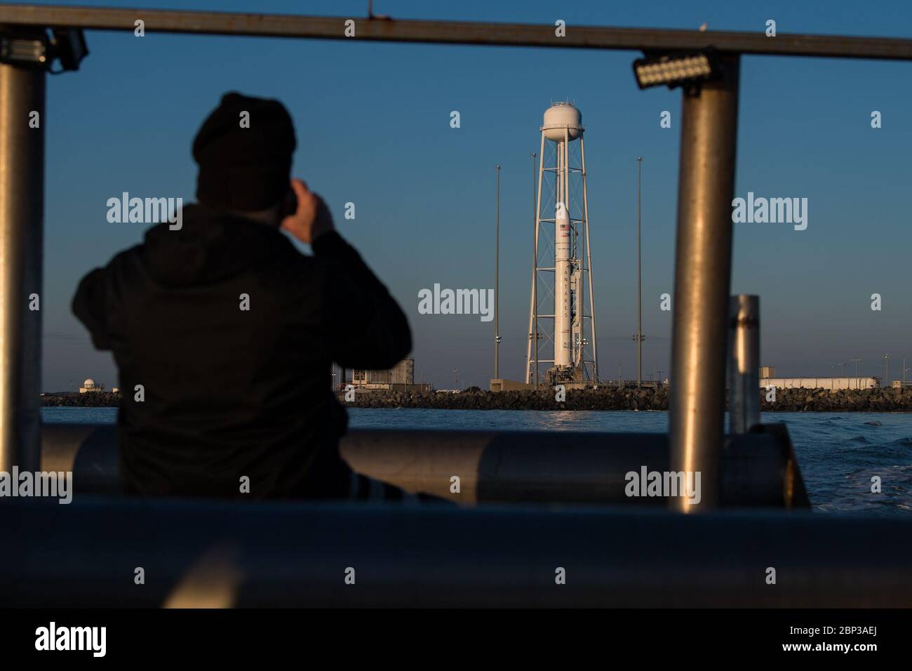 Northrop Grumman Antares CRS-13 Prelaunch A Northrop Grumman Antares rocket carrying a Cygnus resupply spacecraft is seen out of the back of a boat at sunrise on Pad-0A, Sunday, Feb. 9, 2020, at NASA's Wallops Flight Facility in Virginia. Northrop Grumman’s 13th contracted cargo resupply mission with NASA to the International Space Station will deliver more than 7,500 pounds of science and research, crew supplies and vehicle hardware to the orbital laboratory and its crew. The CRS-13 Cygnus spacecraft is named after the first African American astronaut, Major Robert Henry Lawrence Jr.. Stock Photo