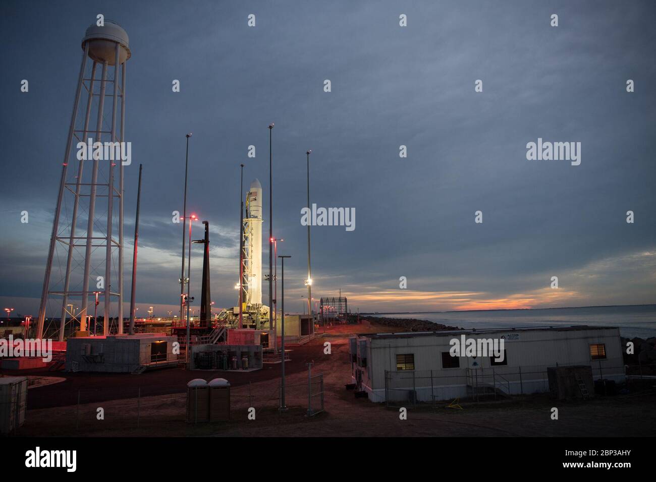 Northrop Grumman Antares CRS-13 Prelaunch  A Northrop Grumman Antares rocket carrying a Cygnus resupply spacecraft is seen at sunrise on Pad-0A, Friday, Feb. 14, 2020, at NASA's Wallops Flight Facility in Virginia. Northrop Grumman’s 13th contracted cargo resupply mission with NASA to the International Space Station will deliver more than 7,500 pounds of science and research, crew supplies and vehicle hardware to the orbital laboratory and its crew. The CRS-13 Cygnus spacecraft is named after the first African American astronaut, Major Robert Henry Lawrence Jr., and is scheduled to launch at 3 Stock Photo