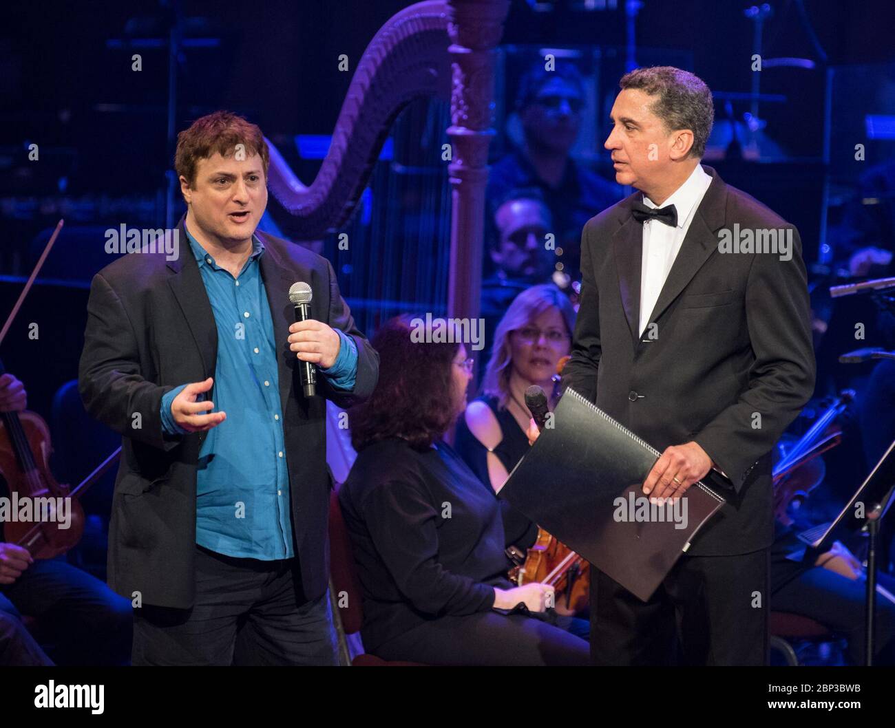 NASA Celebrates 60th Anniversary with National Symphony Orchestra  Carl Sagan's son, Nick Sagan, left, speaks at the &quot;National Symphony Orchestra Pops: Space, the Next Frontier&quot; event celebrating NASA's 60th Anniversary, Friday, June 1, 2018 at the John F. Kennedy Center for the Performing Arts in Washington. The event featured music inspired by space including artists Will.i.am, Grace Potter, Coheed &amp; Cambria, John Cho, and guest Nick Sagan. Stock Photo