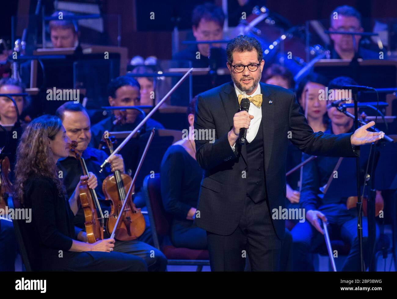 NASA Celebrates 60th Anniversary with National Symphony Orchestra  Composer Michael Giacchino speaks during the &quot;National Symphony Orchestra Pops: Space, the Next Frontier&quot; event celebrating NASA's 60th Anniversary, Friday, June 1, 2018 at the John F. Kennedy Center for the Performing Arts in Washington. The event featured music inspired by space including artists Will.i.am, Grace Potter, Coheed &amp; Cambria, John Cho, and guest Nick Sagan, son of Carl Sagan. Stock Photo