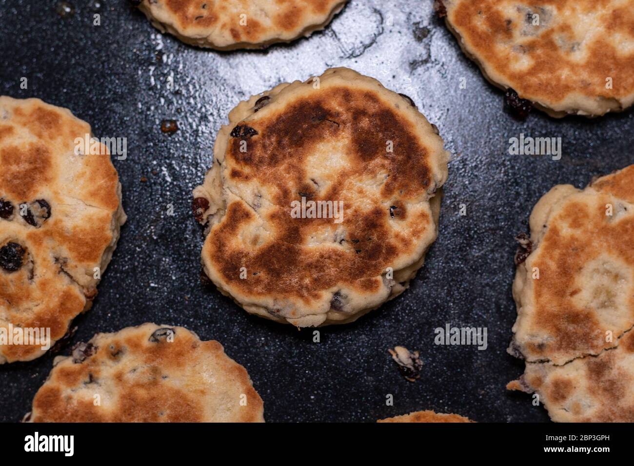 Stack of Homemade Welsh Cakes (Bakestones) freshly cooked on a green plate Stock Photo Alamy