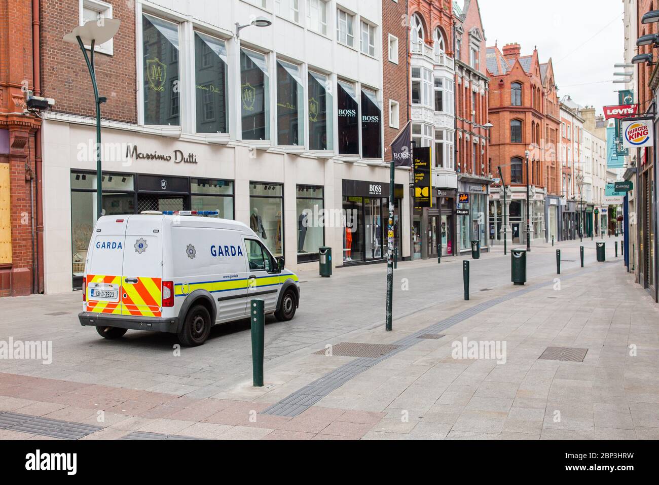 Garda patrols on Grafton Str. Limited footfall and traffic in Dublin City Centre and shops and businesses closed due to Covid-19 pandemic restrictions. Stock Photo