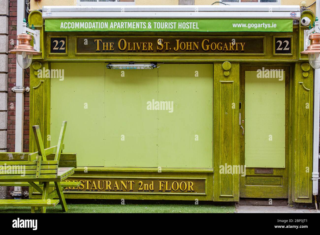 Dublin, Ireland. 17th May 2020. Green facade of Oliver St. John Gogarty's Pub and Hostel closed temporarily due to coronavirus pandemic restrictions. Stock Photo