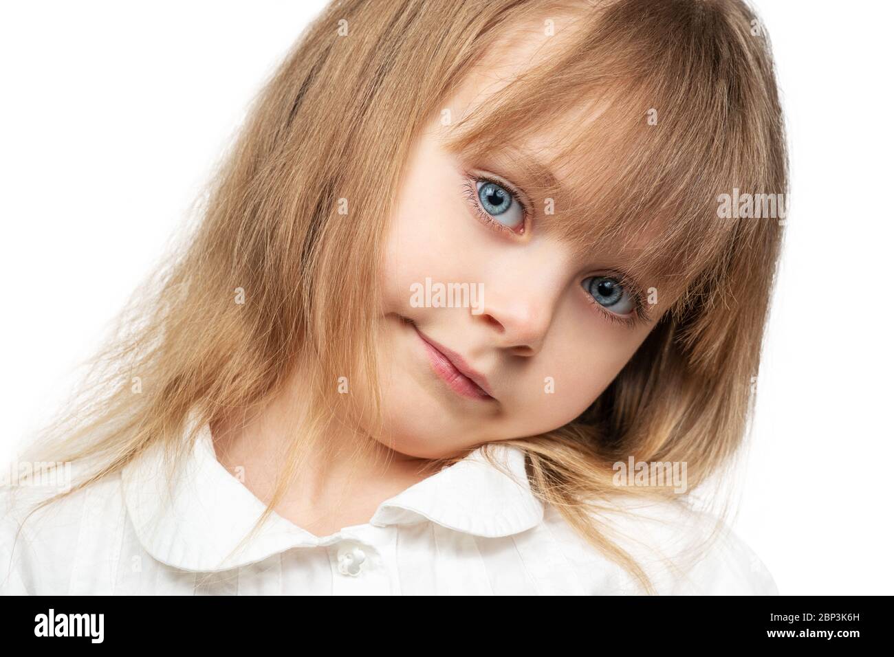 Portrait of a beautiful little girl with blue eyes and flowing hair ...