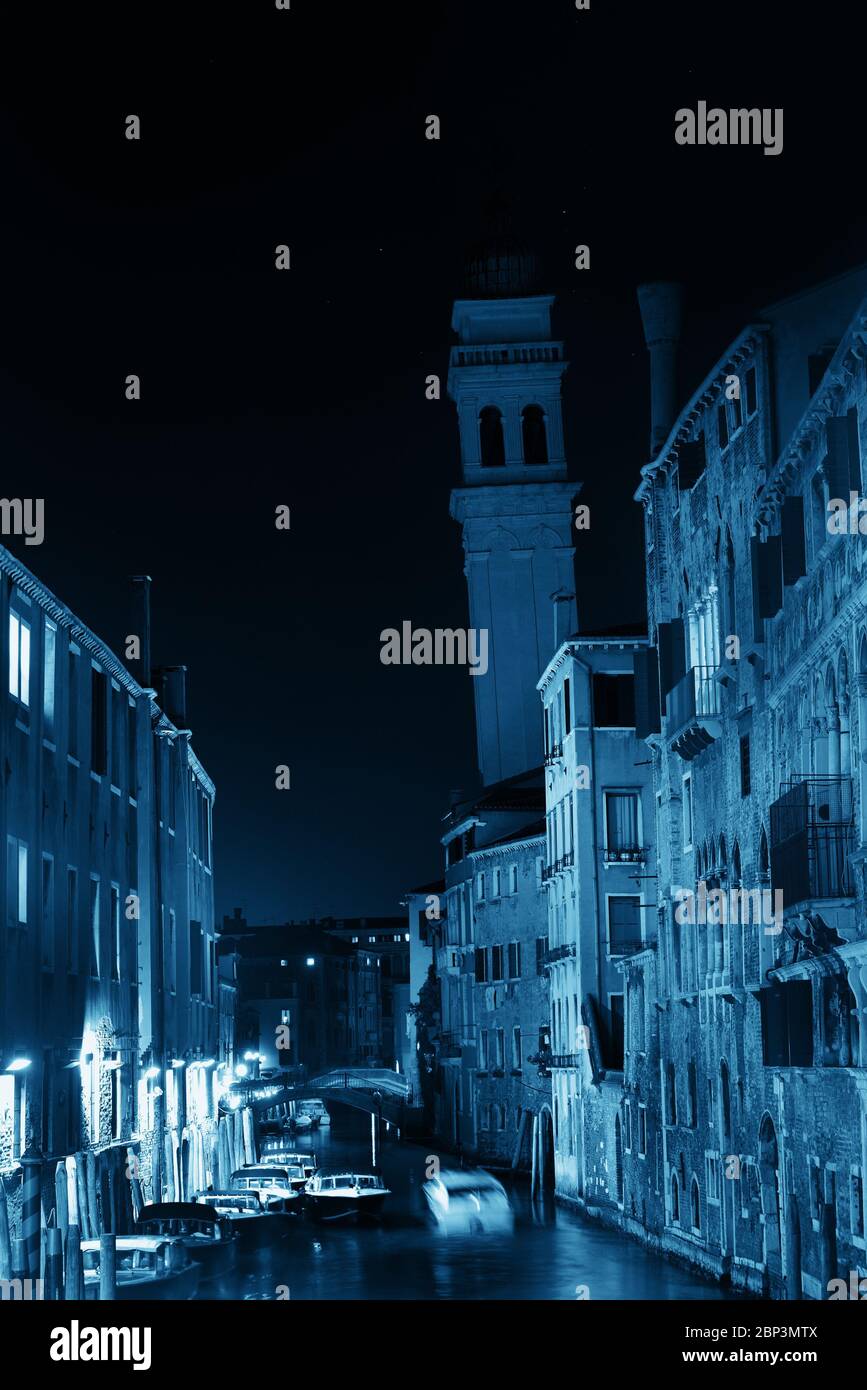 Venice canal view at night with bell tower. Italy Stock Photo - Alamy