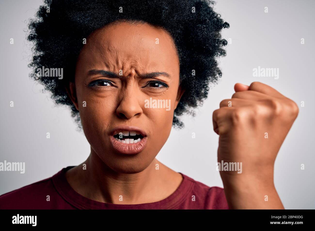 Young beautiful African American afro woman with curly hair standing ...