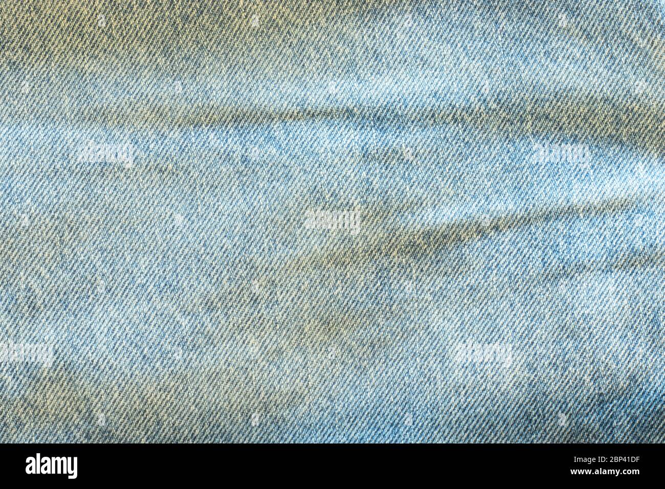 Denim texture macro shot. Blue light jeans background with copy space Stock Photo