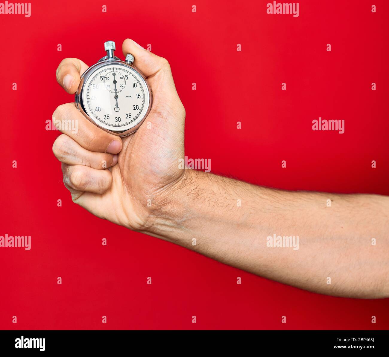 Beautiful hand of man holding stopwatch doing countdown over isolated ...
