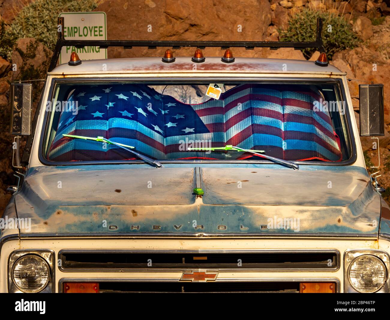 Vintage 1960 Chevrolet picku[ truck with American flag inside near the Hoover dam. Stock Photo