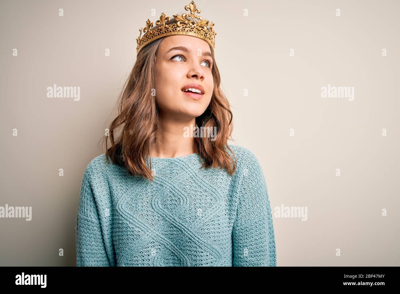 queen and smiling king with crowns holding hands isolated on grey Stock  Photo - Alamy