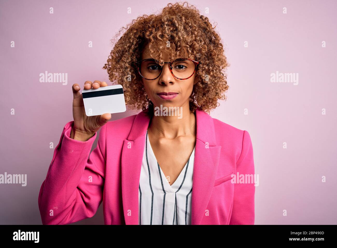 Young african american business woman holding id card identification