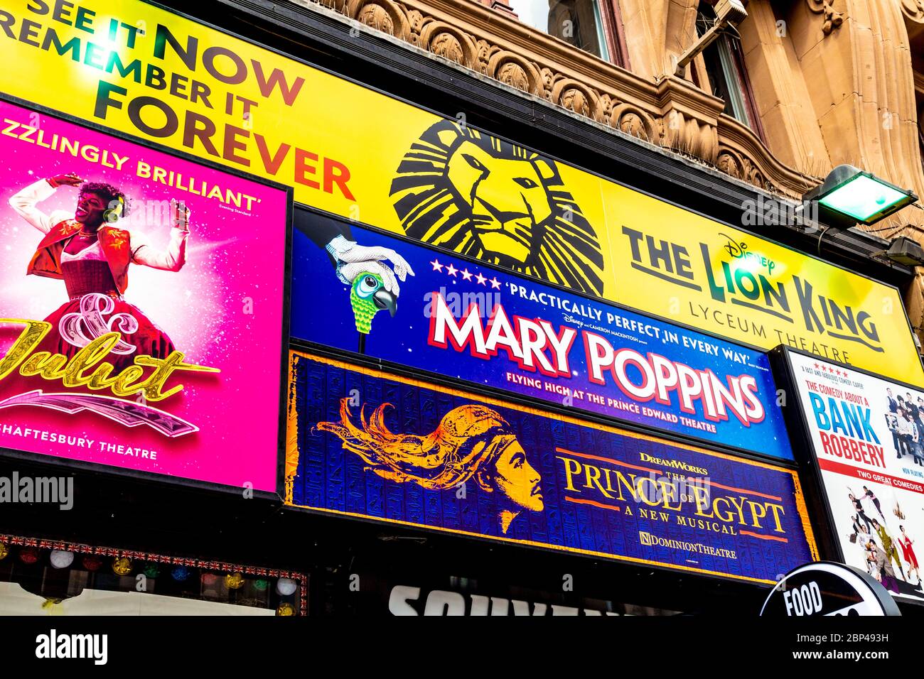 Signs advertising West End musicals at a ticket discount shop in Leicester Square, London, UK Stock Photo