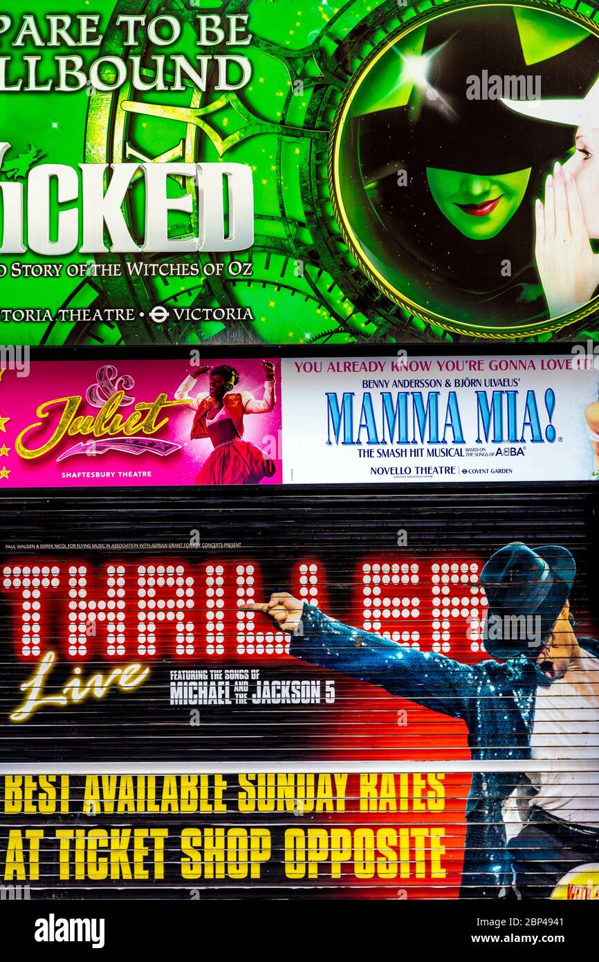Signs advertising West End musicals at a ticket discount shop in Leicester Square, London, UK Stock Photo