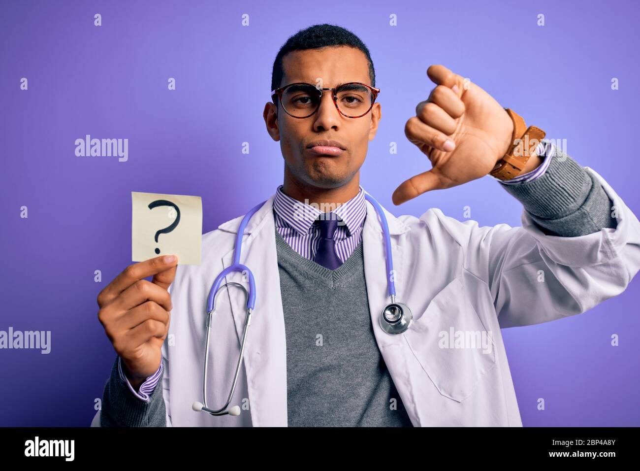 Handsome african american doctor man wearing stethoscope holding ...