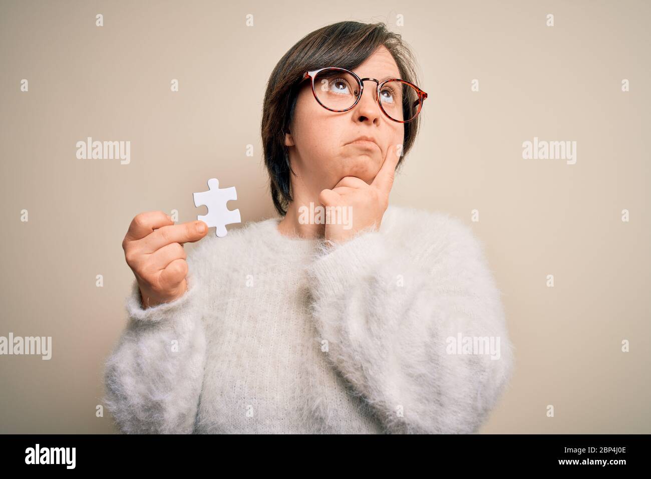 Confused young woman jigsaw hi-res stock photography and images - Alamy
