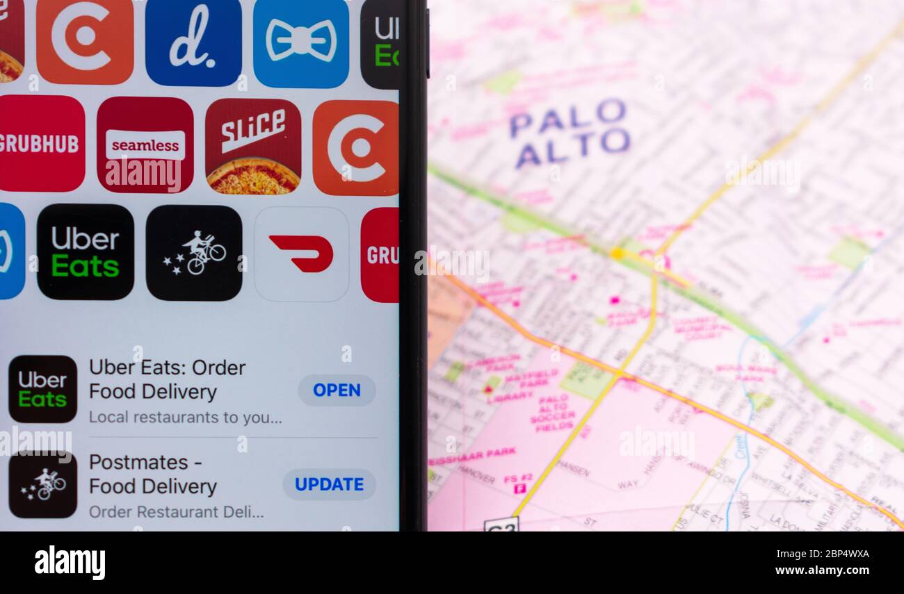 Mobile app icons of competing food delivery services on a 