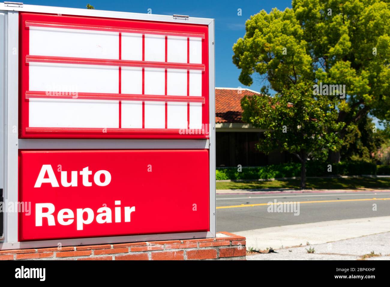 Empty price display board on gas station. Auto repair sign. Background