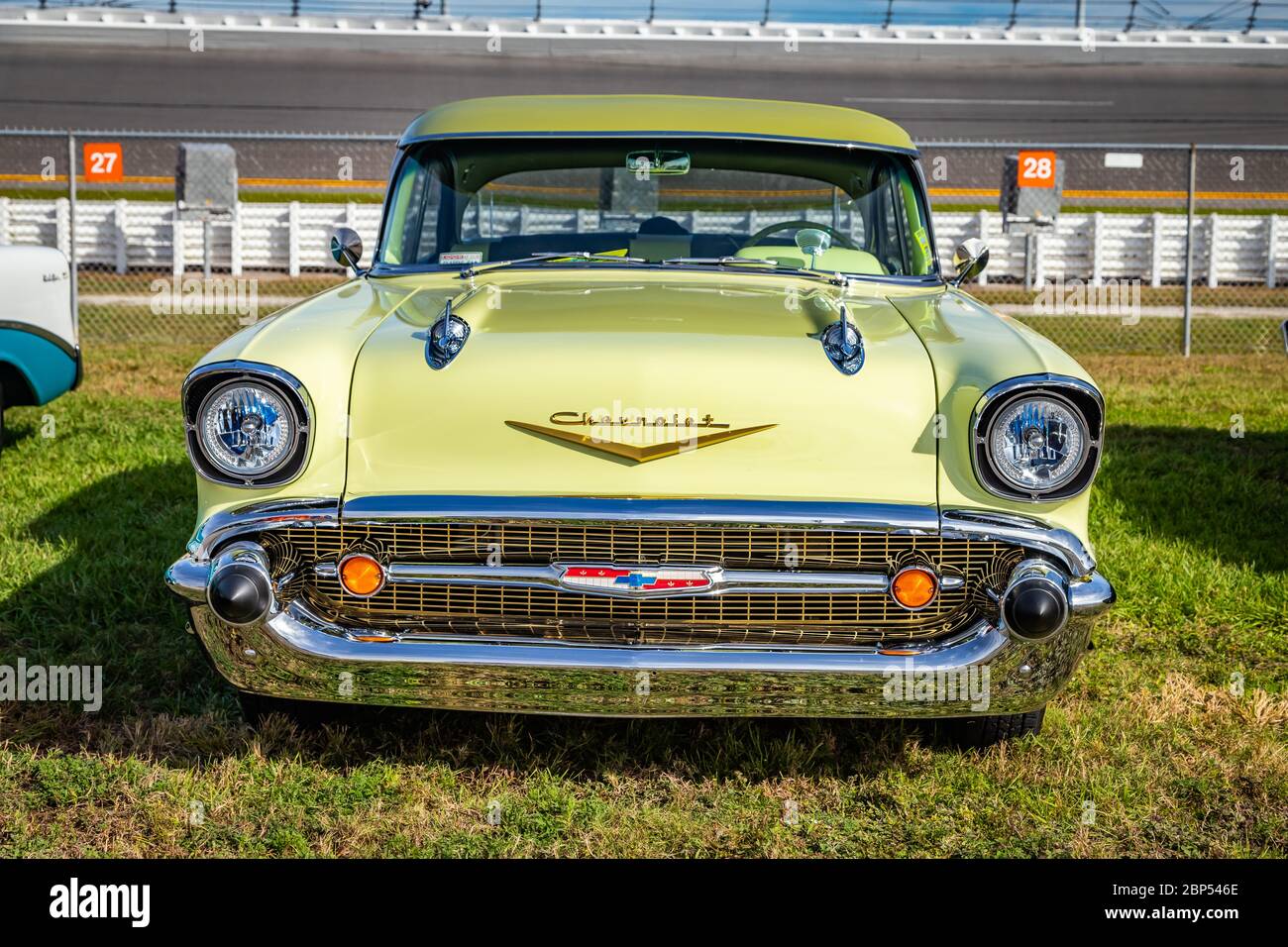 Daytona Beach, FL / USA- November 24, 2018: 1957 yellow Chevrolet 4 door hardtop sedan at the Fall 2018 Daytona Turkey Run. Stock Photo