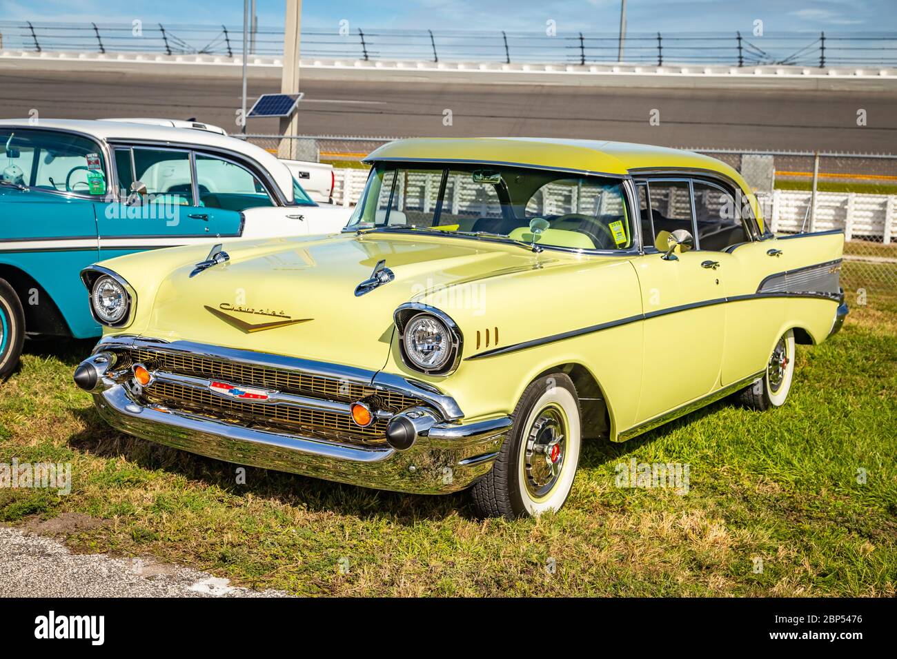 Daytona Beach, FL / USA- November 24, 2018: 1957 yellow Chevrolet 4 door hardtop sedan at the Fall 2018 Daytona Turkey Run. Stock Photo