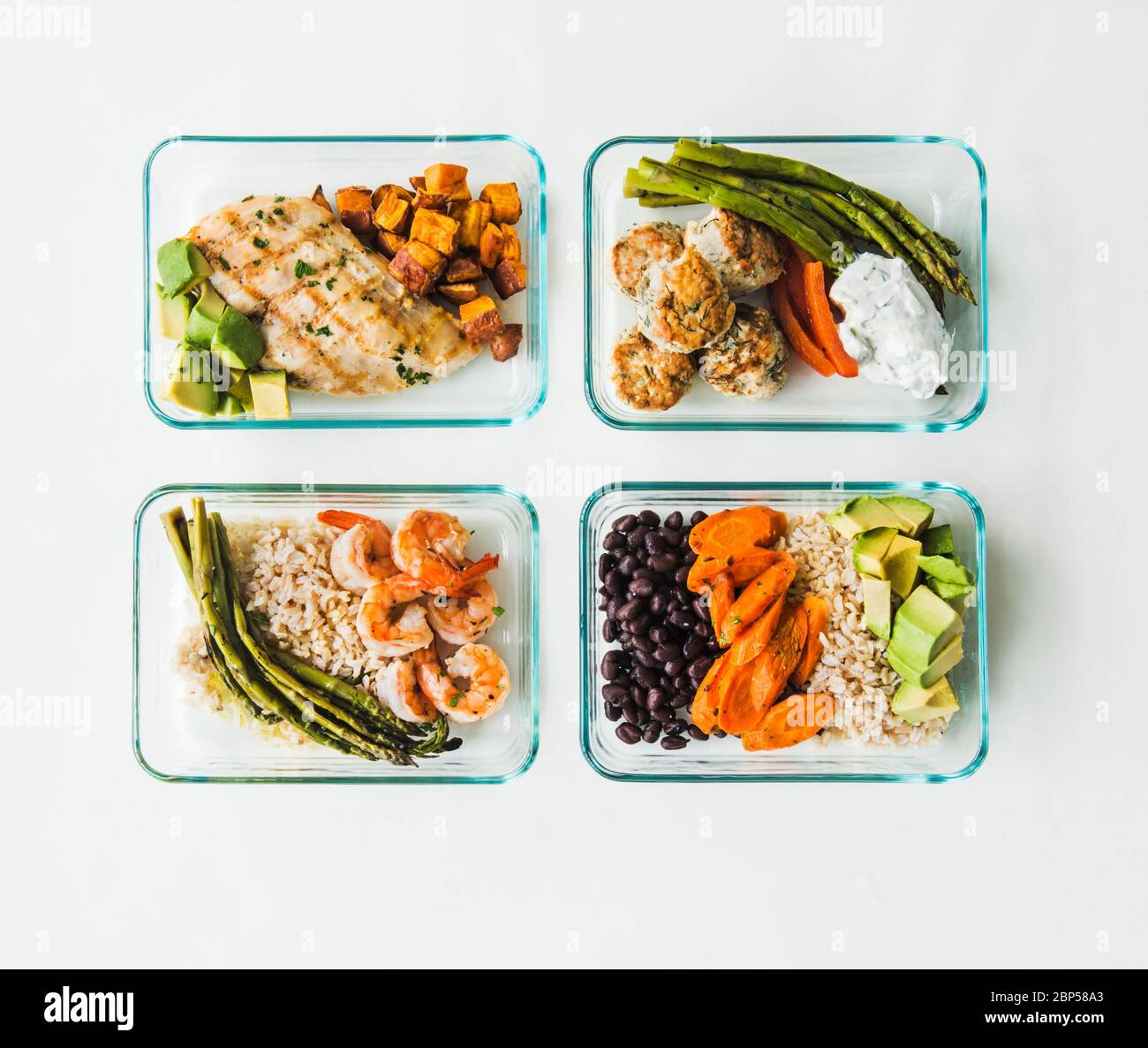 Meal prep containers filled with healthy lunches Stock Photo