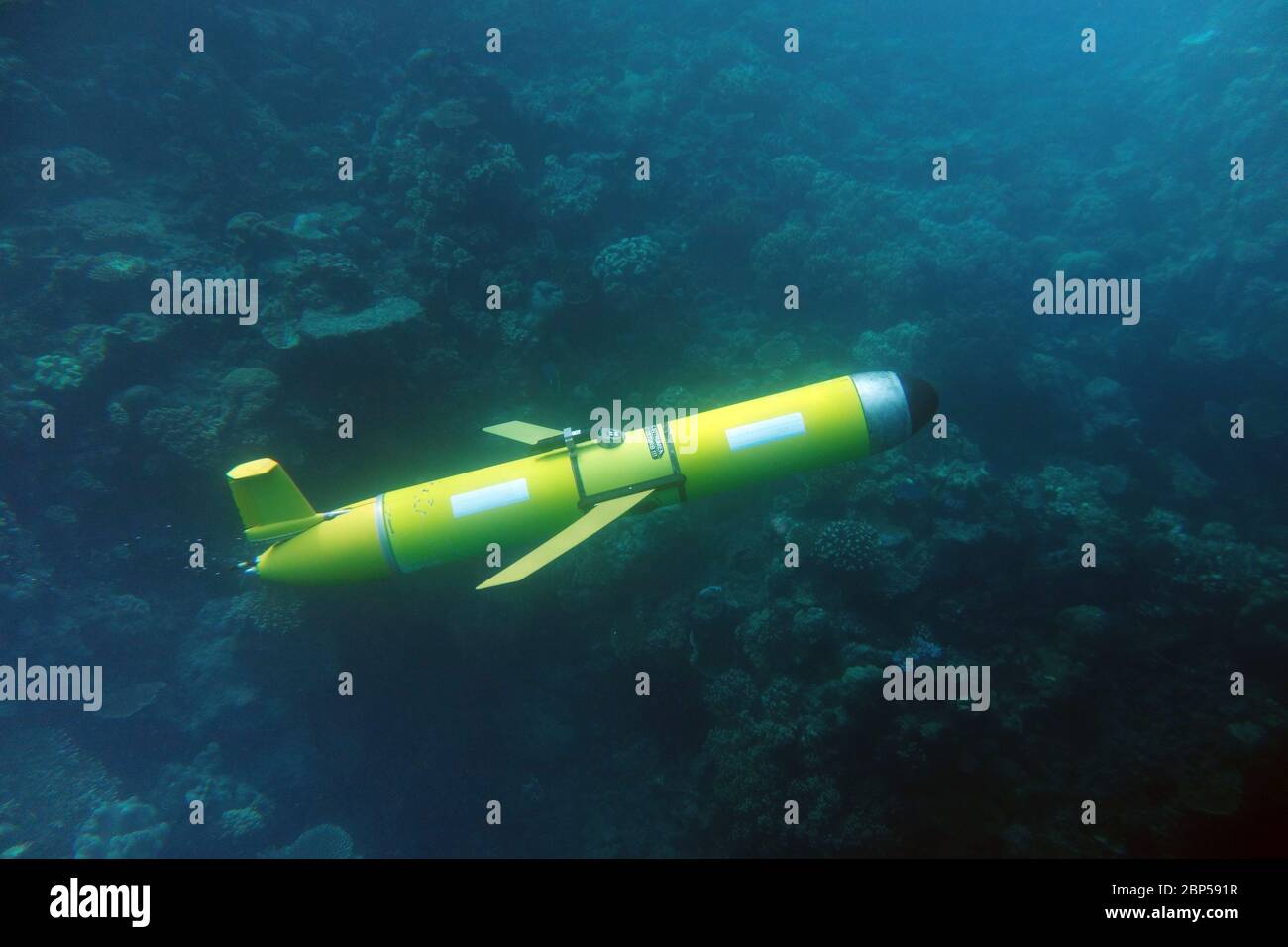 Slocum ocean glider underwater near coral reef, Great Barrier Reef