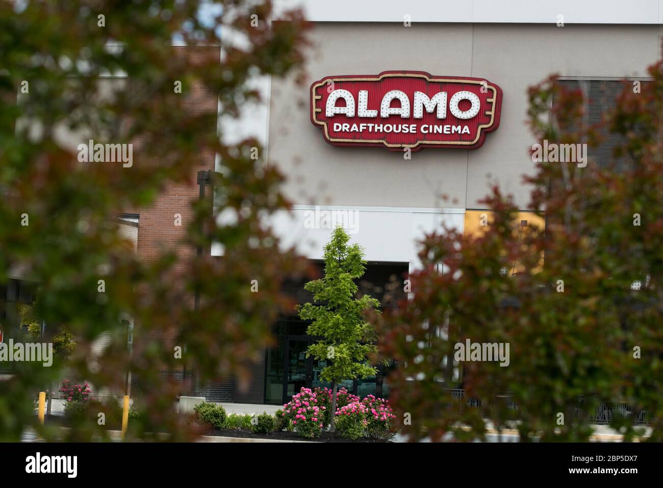 A logo sign outside of a The Alamo Drafthouse Cinema movie theater