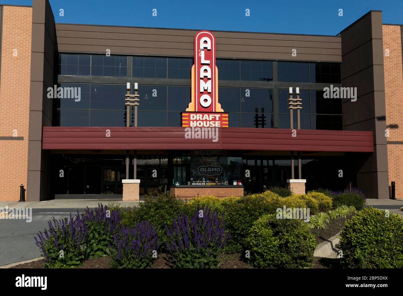 A logo sign outside of a The Alamo Drafthouse Cinema movie theater location in Winchester, Virginia on May 13, 2020. Stock Photo