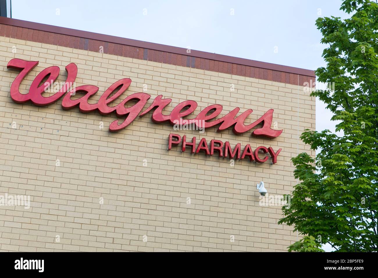A logo sign outside of a Walgreens Pharmacy store location in Richmond