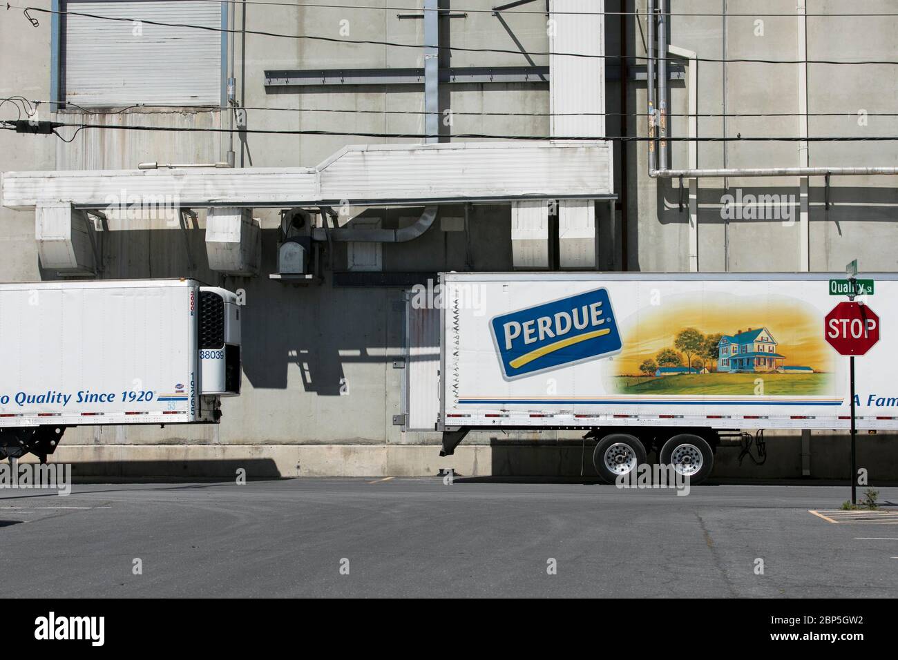 A logo sign outside of a Perdue Farms poultry processing plant in