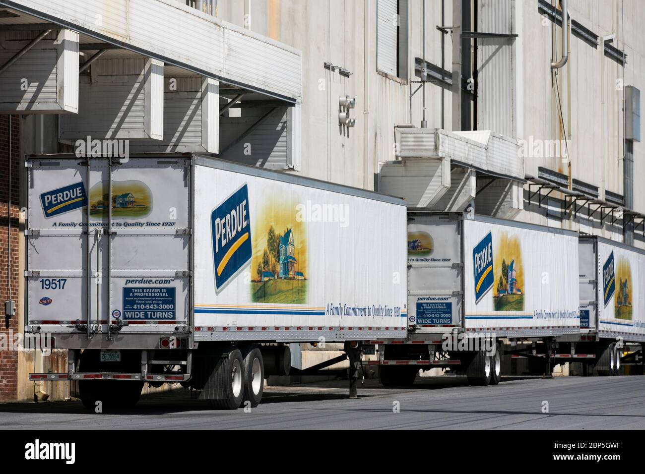A logo sign outside of a Perdue Farms poultry processing plant in