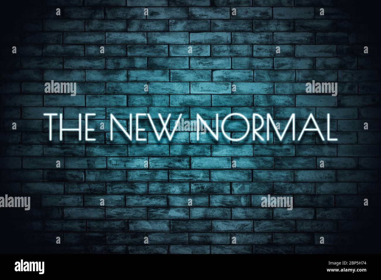 The New Normal. Neon light lettering  on brickwall background. New normal after covid-19 pandemic Background concept for poster, social network, banne Stock Photo