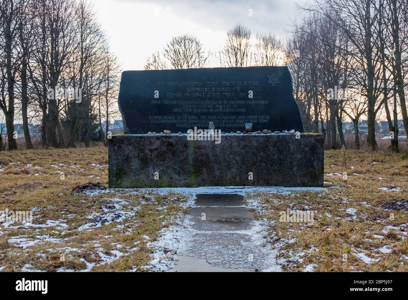 The black granite marker, commemorating the place where all the Jewish men from the town were executed. In Eišiškės, Lithuania. The town is the source Stock Photo