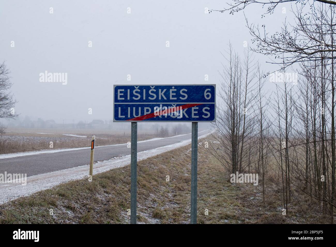 A road, highway sign marking the entrance to the town. In Eišiškės, Lithuania. The town is the source for the photograph installation room at the Unit Stock Photo