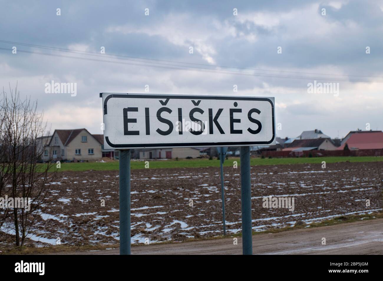 A road, highway sign marking the entrance to the town. In Eišiškės, Lithuania. The town is the source for the photograph installation room at the Unit Stock Photo