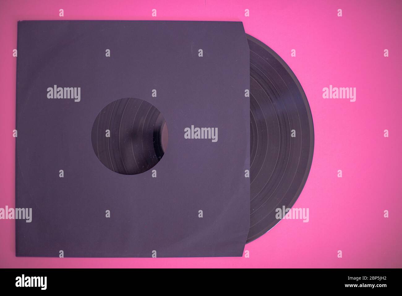 Vinyl record isolated against colorful background Stock Photo