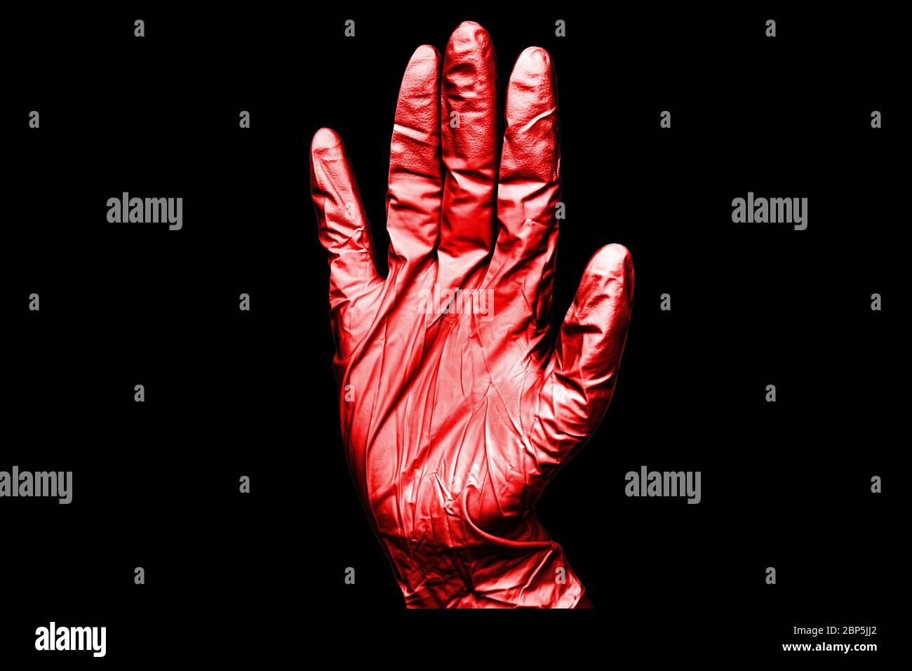 Human hand in red rubber medical glove on black background isolated closeup, one surgeon hand in bloody latex protective glove, doctor's hand in glove Stock Photo