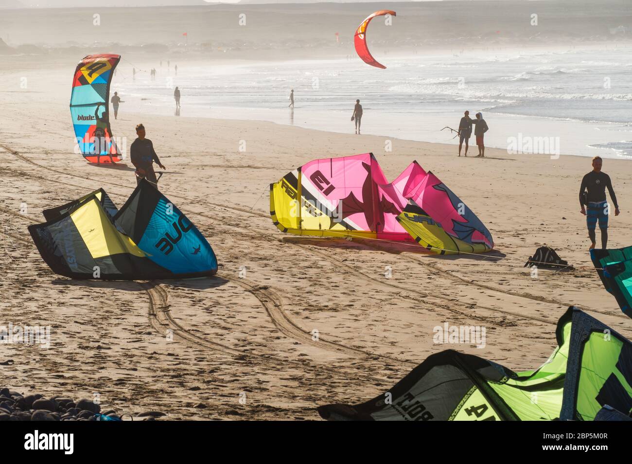 LANZAROTE, SPAIN - NOVEMBER 28, 2016: Kitesurfing in Caleta de Famara, in Lanzarote, Canary Islands, in Spain Stock Photo