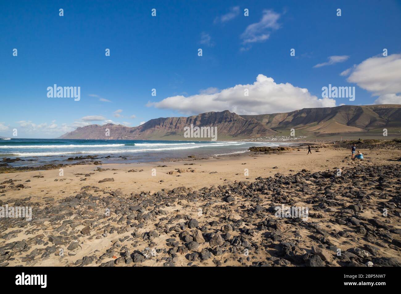 LANZAROTE, SPAIN - NOVEMBER 28, 2016:  people in the Caleta de Famara, in Lanzarote, Canary Islands, in Spain Stock Photo