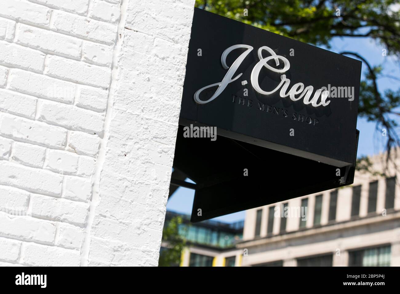 A logo sign outside of a J.Crew The Men's Shop retail store location in Washington, D.C., on May 12, 2020. Stock Photo