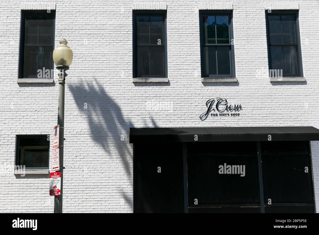 A logo sign outside of a J.Crew The Men's Shop retail store location in Washington, D.C., on May 12, 2020. Stock Photo