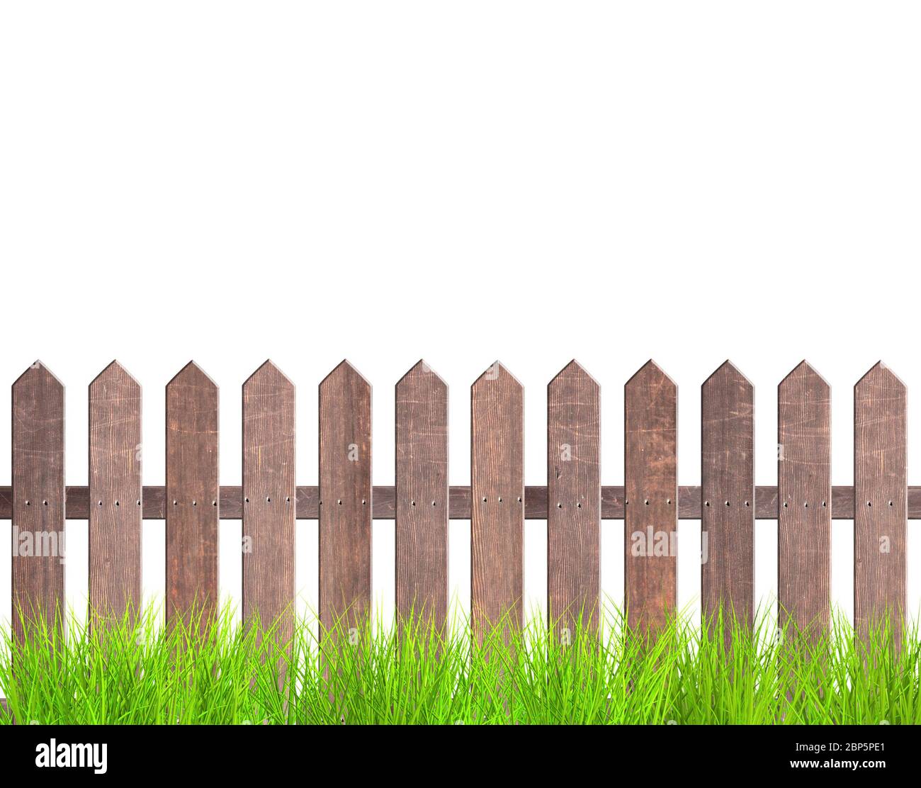 Rustic wooden fence and green grass. Old garden fence with wood planks