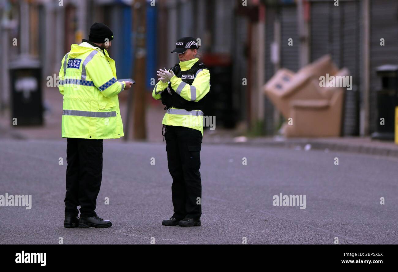 Police officers at the scene on King Street, Blackburn, following the death of a woman from a suspected gunshot wound on Sunday. PA Photo. Picture date: Monday May 18, 2020.See PA story POLICE Blackburn. Photo credit should read: Peter Byrne/PA Wire Stock Photo